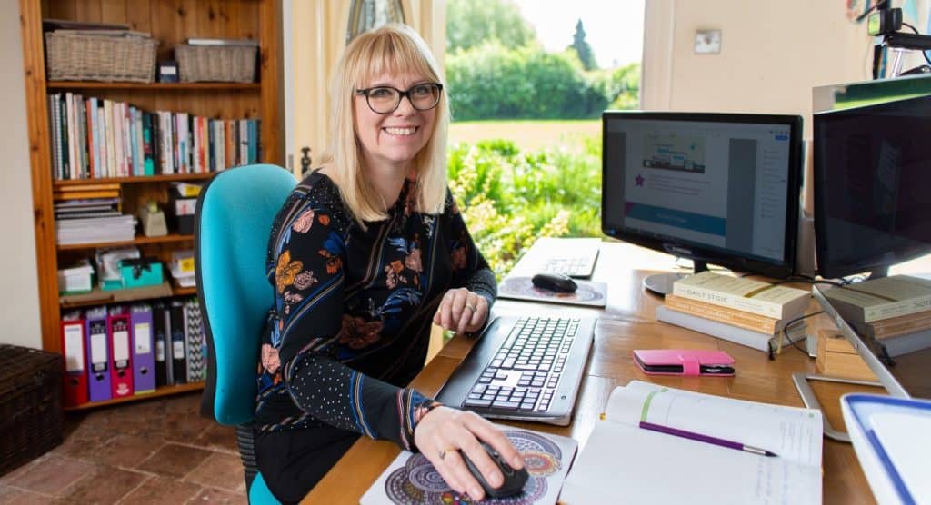 Imogen Allen working at her desk